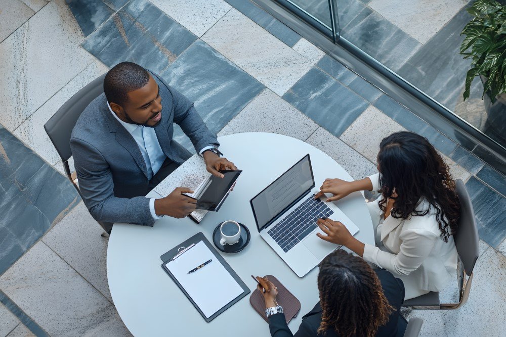 Top view of three business people sitting at the tab 1725404156 3